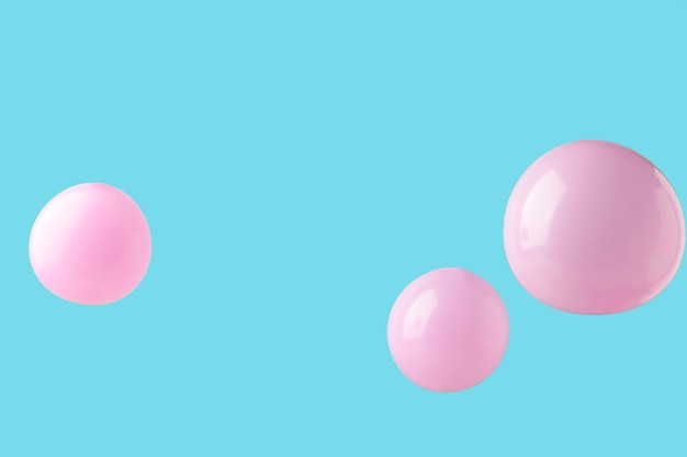 Globos de color rosa pastel sobre fondo rosa. Minimalismo. Vista superior