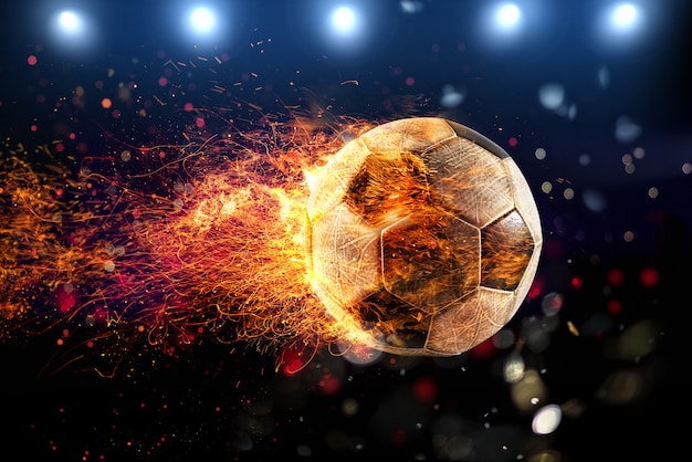 Foto potente patada de un balón de fútbol con llama de fuego