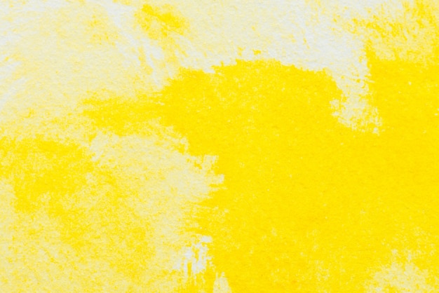 Foto gratuita acuarela abstracta amarilla con textura sobre papel blanco
