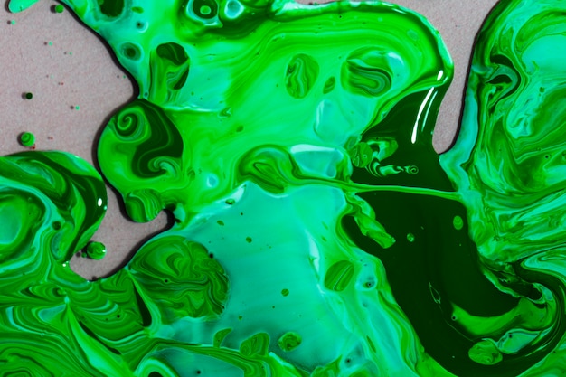 Бесплатное фото Вид сверху композиция с зеленой краской
