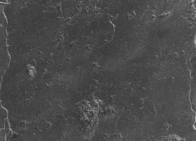 Бесплатное фото Неравномерное ухабистым черный цемент поверхность