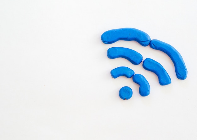 Free photo wifi symbol drawn from modelling clay with copy-space