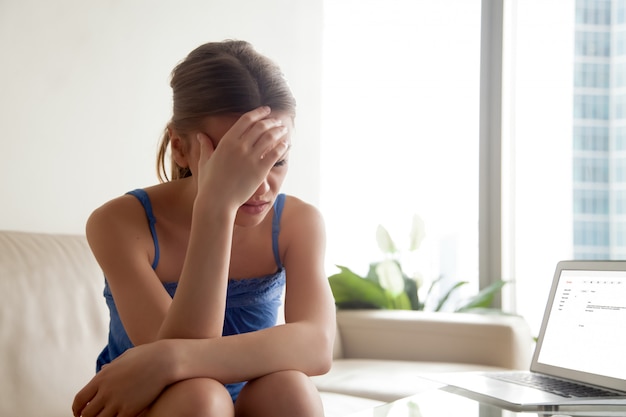 Free photo woman upset because of bad news in e-mail letter