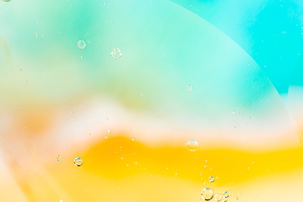 Free photo abstract coloured background with variety of transparent raindrops