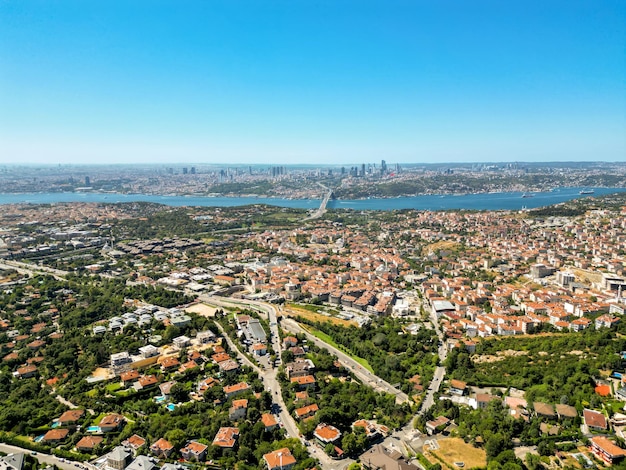 Free photo aerial drone view of istanbul turkey residential district with multiple residential buildings and greenery golden horn waterway downtown on the background