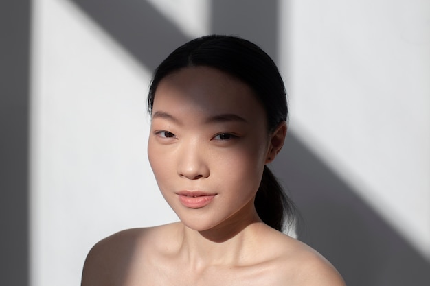 Free photo beautiful asian woman posing with perfect skin