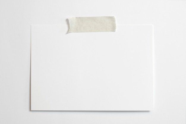 Free photo blank horizontal photo frame 10 x 15 size with soft shadows  and scotch tape isolated on white paper background
