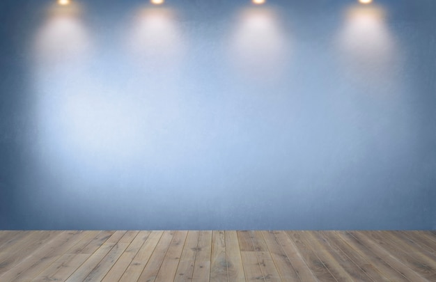 Free photo blue wall with a row of spotlights in an empty room