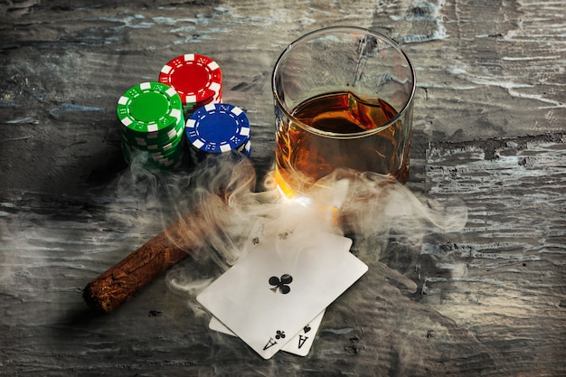 Free photo cigar, chips for gamblings, drink and playing cards