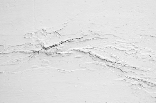 Free photo cracked cemented concrete wall texture background