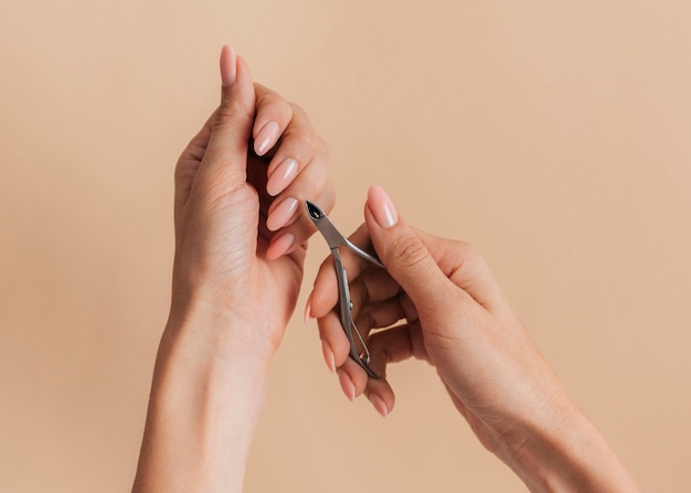 Free photo cutting cuticles healthy beautiful manicure