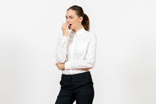 Free photo female worker in elegant white blouse with nervous face on white