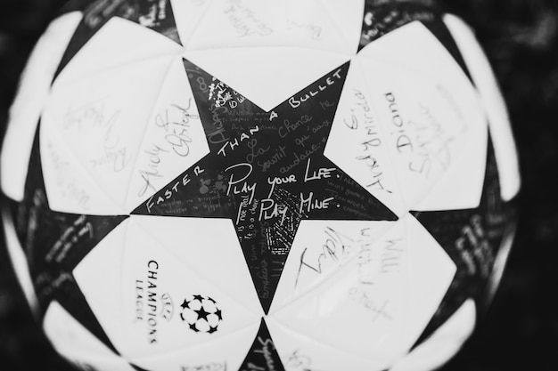 Free photo foot ball with stars and writings 'play your life, i play mine', ' faster than a bullet'