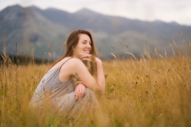 Free photo full shot smiley woman in nature