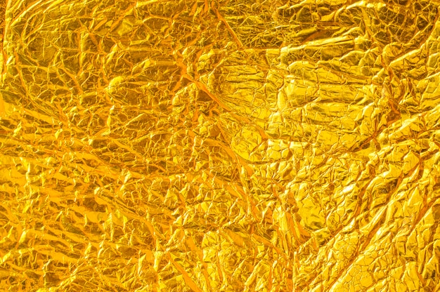 Бесплатное фото Золотая бетонная текстура из фольги