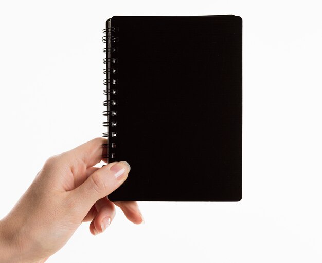 Hand holding notebook