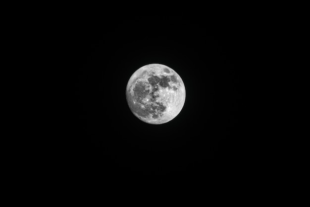 Free photo low angle shot of the breathtaking full moon captured in the night sky