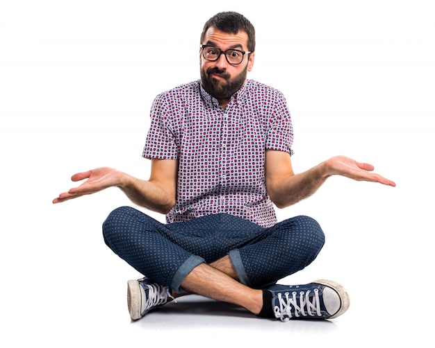 Free photo man with glasses making unimportant gesture