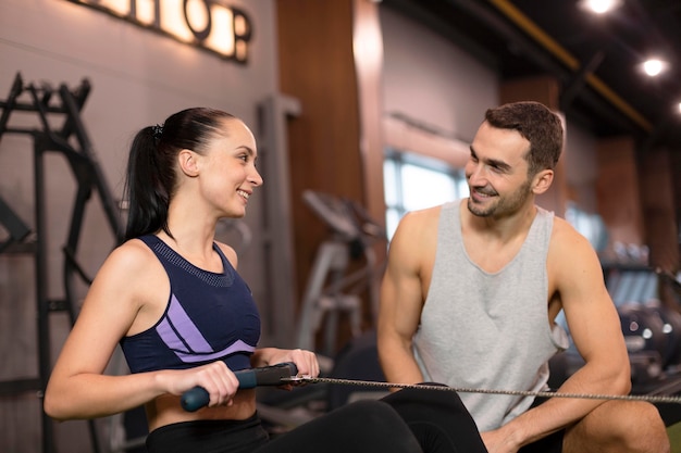 Free photo medium shot woman with personal trainer