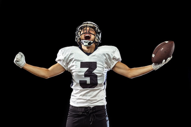 Free photo portrait of american football player in sports equipment isolated on black
