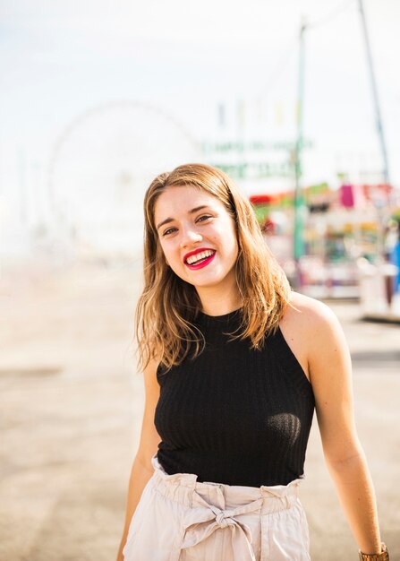 Portrait of stylish young woman with red lipstick