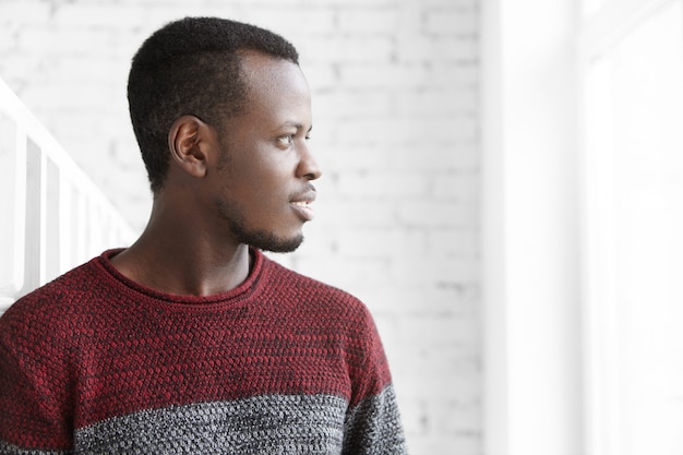 Free photo profile of handsome african young student wearing casual sweater