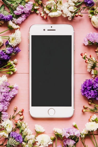 Free photo smartphone in colorful small flowers