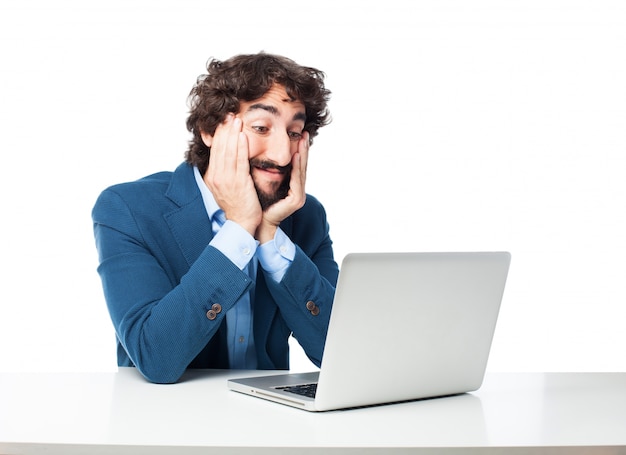 Free PSD astonished employee looking at his laptop