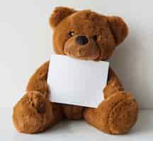 Free PSD teddy holding paper