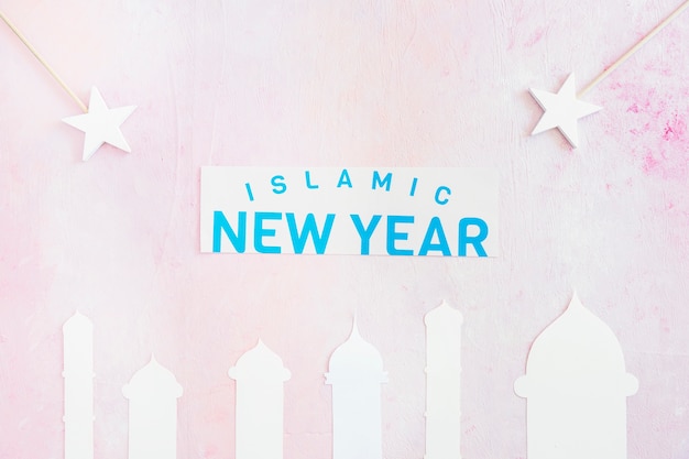 Photo gratuite nouvel an islamique avec mosquée et étoiles sur rose