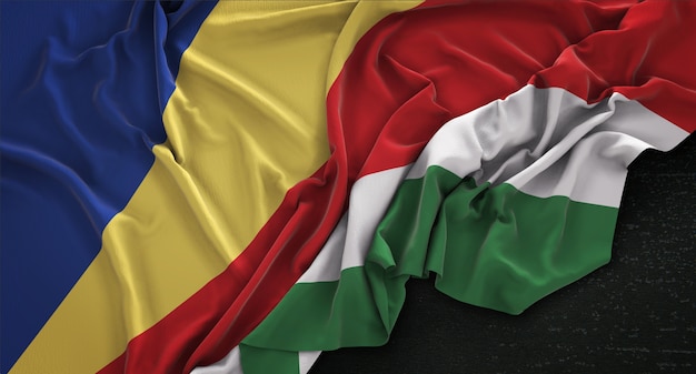 Photo gratuite drapeau des seychelles enroulé sur fond sombre 3d render