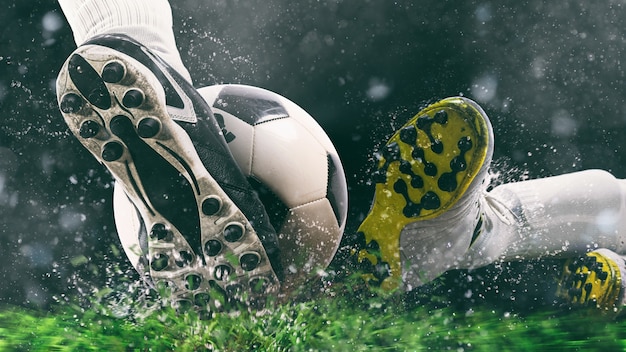 Photo scène de football au match de nuit avec gros plan d'une chaussure de football frapper la balle avec puissance