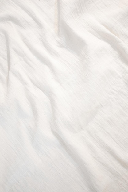 Photo toile de fond en tissu toile de lin blanc tissu de coton naturel froissé fond de vue de dessus en lin naturel fait à la main textiles écologiques biologiques texture de tissu blanc