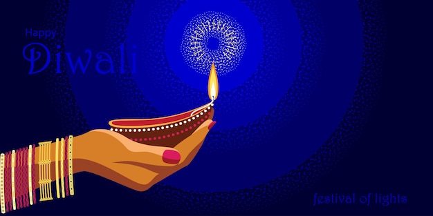 Lampa Diwali trzymana jest przez kobiecą rękę