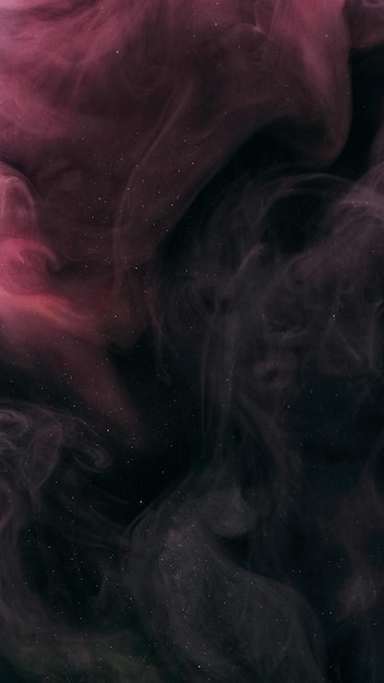 Eksplozja chmury atramentu kropla wody rozproszona różowy czarny kolor błyszcząca tekstura eteryczny przepływ fali dymu