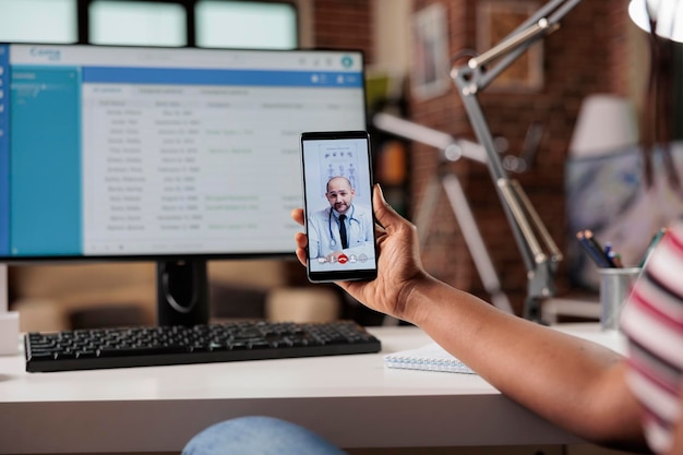 Telemedicine, online medical consultation, woman having live chat with therapist. Patient talking with doctor on smartphone video call, general practitioner on mobile phone screen