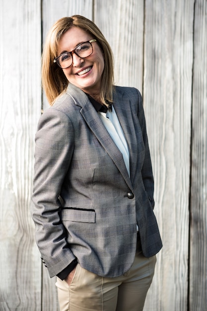 Woman wearing a suit and glasses