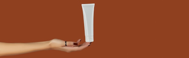 Womans hand holding white tube on brown background Self care concept