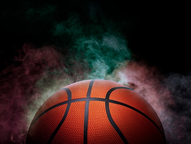 Photo basketball on the color smoke background