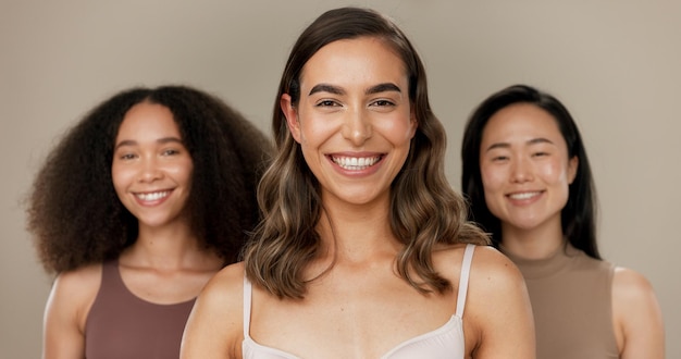 Photo beauty diversity group and woman smile for facial cosmetics self care wellness or dermatology makeup women empowerment unique and happy portrait of model friends together on studio background