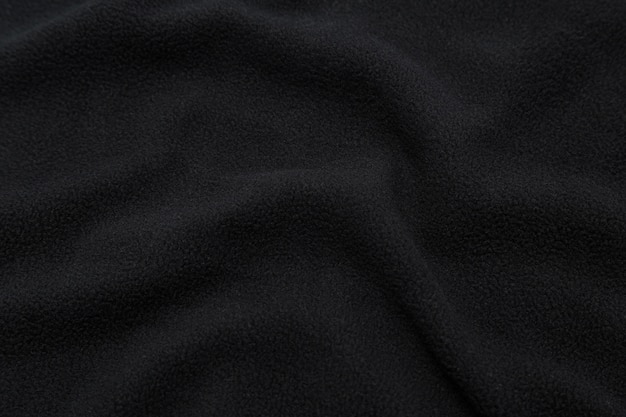 Черная текстура ткани, предпосылка картины ткани.