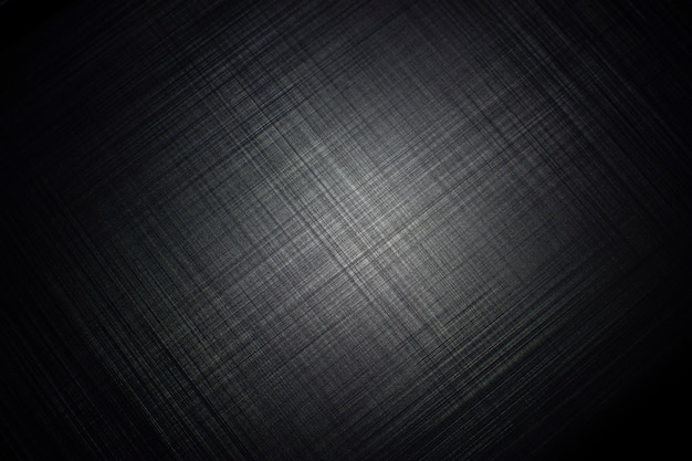Photo black metal striped textured background with a light of spotlight