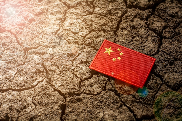 China flag on abandoned cracked ground.