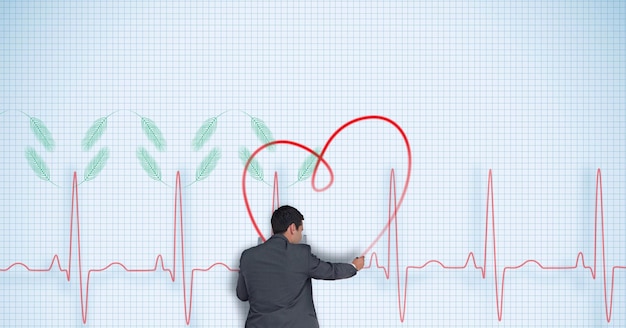 Foto composizione dell'uomo d'affari che disegna il cuore sulla lettura del processore della frequenza cardiaca