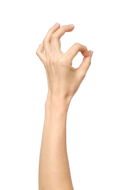 Photo closeup of woman's hand showing ok sign