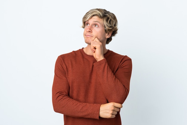 English man over isolated white background having doubts and thinking