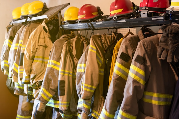 Photo firefighter's uniforms and gear arranged at fire station