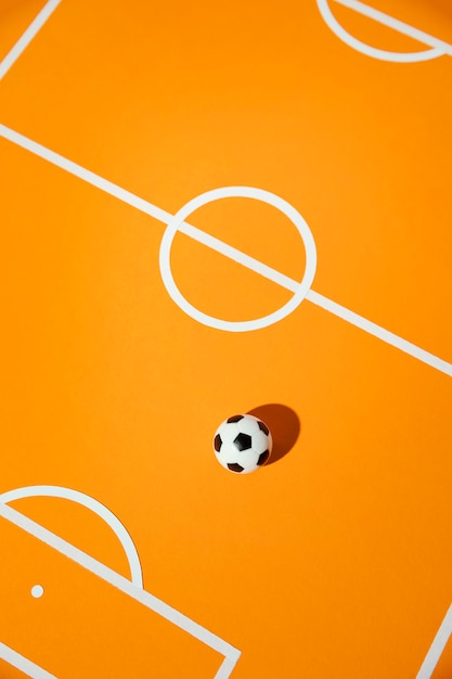 Фото Плоский футбол на поле натюрморт