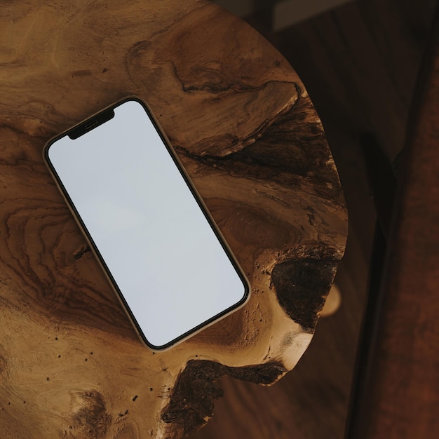 Photo flatlay phone on wooden textured surface aesthetic elegant blog social media web template