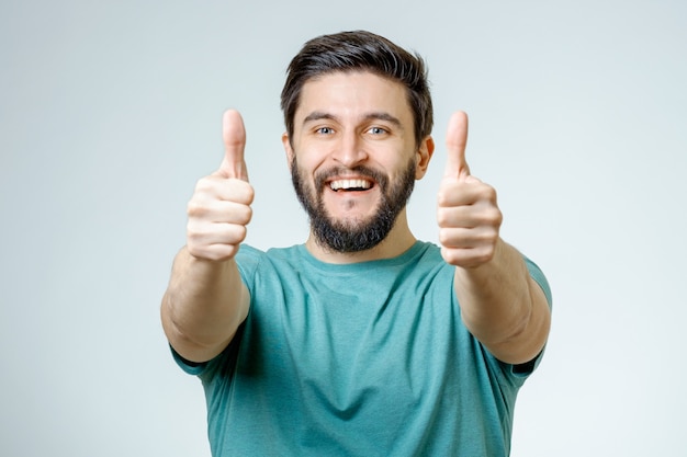 Photo happy man giving thumbs up sign